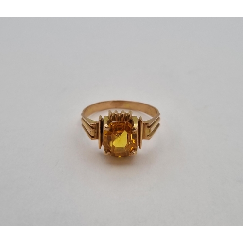 181 - A vintage Dress Ring set synthetic yellow sapphire in rose coloured gold, tests as 10ct, approx 3.10... 