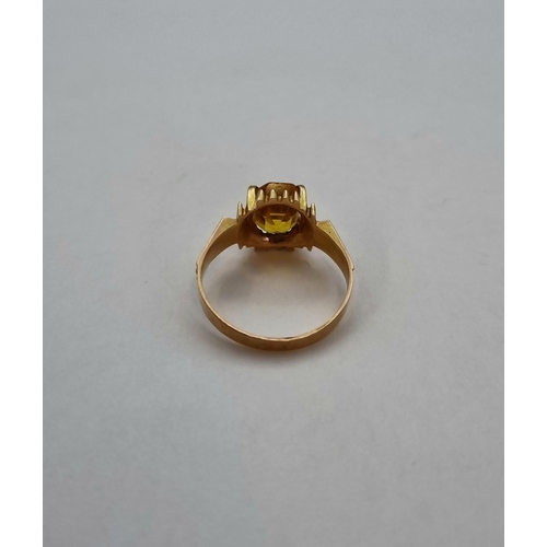 181 - A vintage Dress Ring set synthetic yellow sapphire in rose coloured gold, tests as 10ct, approx 3.10... 