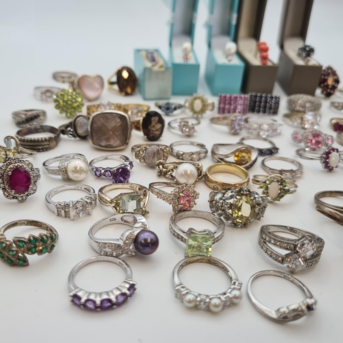 199 - A large collection of mostly silver Dress Rings set various stones