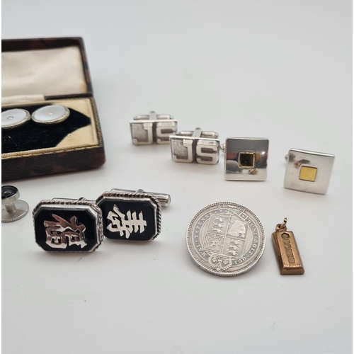 215 - A small 9ct gold Ingot, three pairs of silver Cufflinks, a pair of Cufflinks set mother of pearl and... 