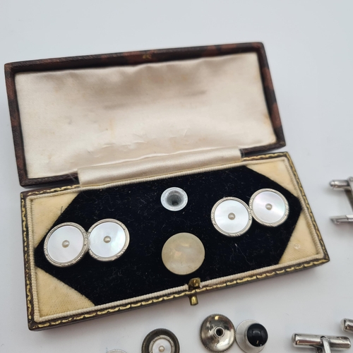 215 - A small 9ct gold Ingot, three pairs of silver Cufflinks, a pair of Cufflinks set mother of pearl and... 