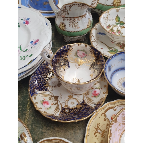 253 - A selection of 19th Century painted porcelain including Cups, Saucers, Sucrier, Milk Jug, Muffin Dis... 