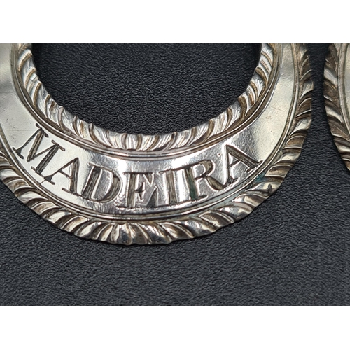 117 - Five Georgian silver crescent shape Labels with gadroon rims and chains, viz: Mountain, Madeira, Cla... 