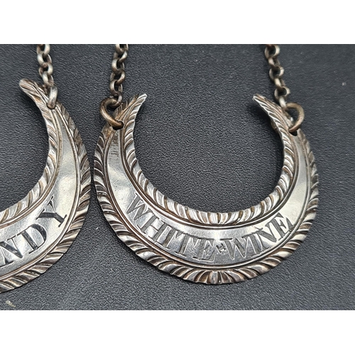 117 - Five Georgian silver crescent shape Labels with gadroon rims and chains, viz: Mountain, Madeira, Cla... 