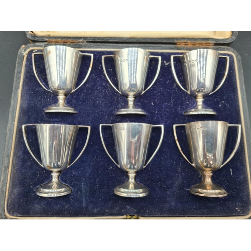 122 - Six George V silver miniature two handled Goblets, Birmingham 1912/16, in case