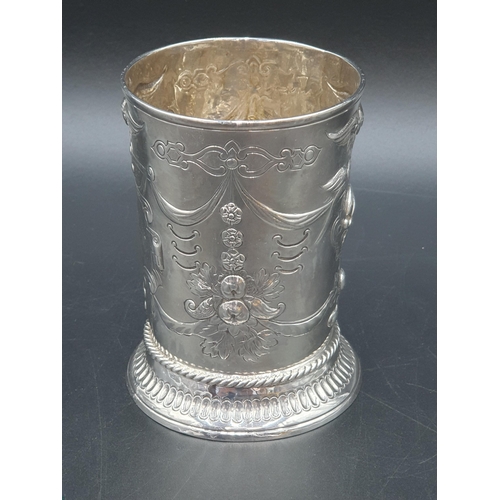 124 - A George III silver Beaker embossed masks, birds and floral swags, vacant cartouche, London 1782, ma... 