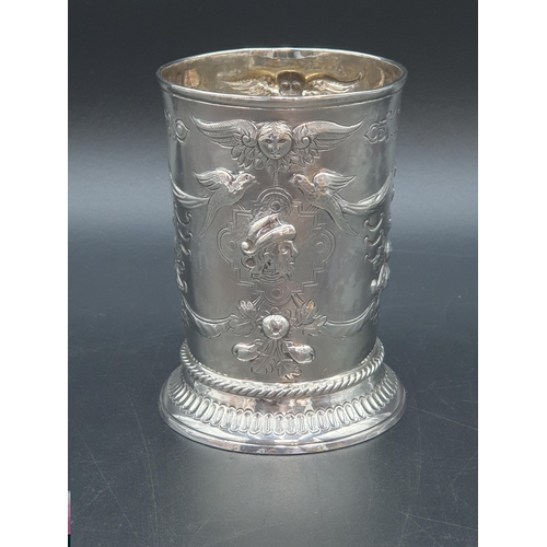 124 - A George III silver Beaker embossed masks, birds and floral swags, vacant cartouche, London 1782, ma... 