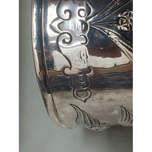 124 - A George III silver Beaker embossed masks, birds and floral swags, vacant cartouche, London 1782, ma... 