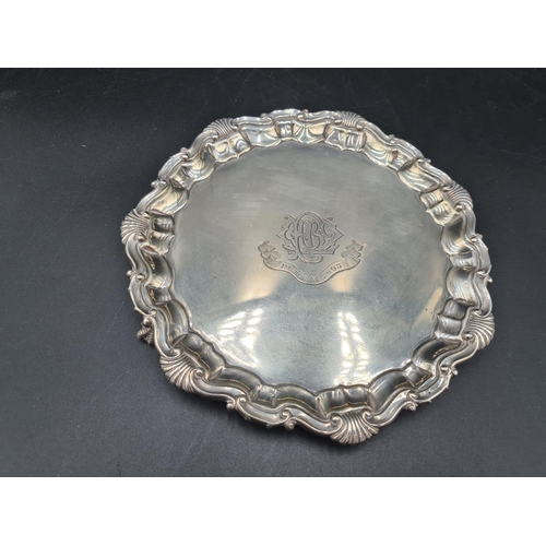 135 - A Victorian silver Card Tray of shaped circular form with scallop and scroll rim, engraved initials ... 