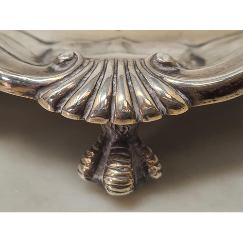 135 - A Victorian silver Card Tray of shaped circular form with scallop and scroll rim, engraved initials ... 