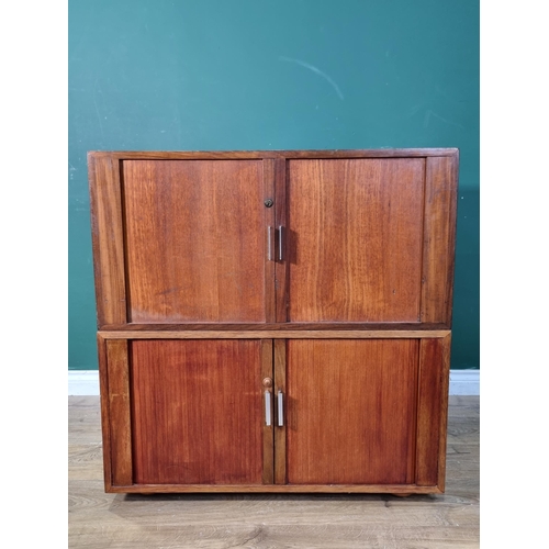 17 - A mid-Century teak Cupboard fitted four tambour doors, 2ft 11