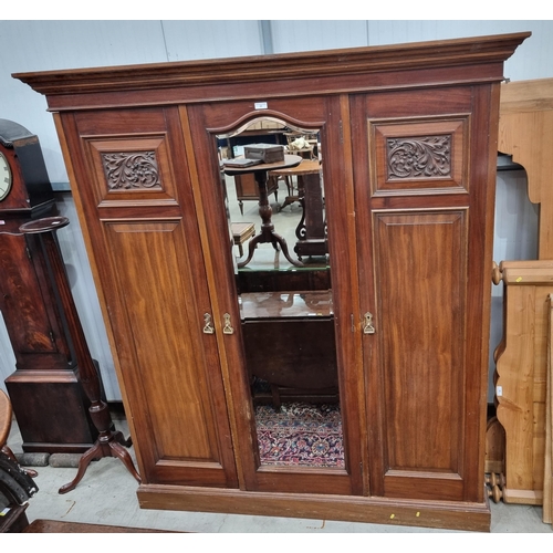 22 - A Mirror Door Wardrobe, with moulded cornice above central bevelled mirror door, flanked by pair of ... 