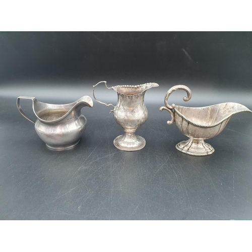 221 - A George III silver Milk Jug engraved initials, London 1809, another Georgian Jug, circa 1770, and a... 