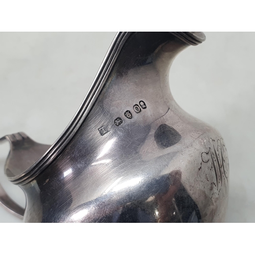 221 - A George III silver Milk Jug engraved initials, London 1809, another Georgian Jug, circa 1770, and a... 