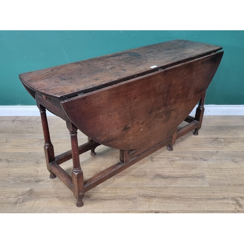 23 - An 18th Century oak Gateleg Table fitted single end drawer raised on turned supports 4ft 6in W x 2ft... 