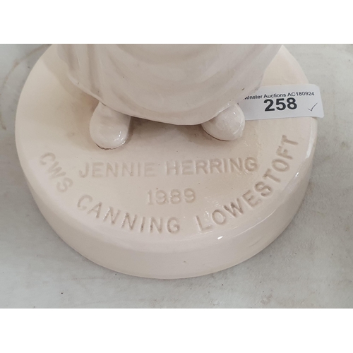 258 - A Lowestoft pottery figure of a lady holding two baskets of fish inscribed 'Jennie Herring, 1989, CW... 