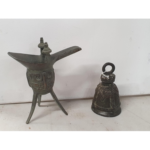 260 - An Eastern bronze ceremonial Wine Pourer, 6in H, and an old metal Bell lacking clanger, (R4)