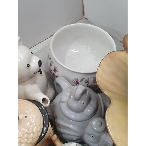 300 - A collection of novelty Teapots, a petal shaped Bowl, a wooden Bowl, etc, (R4)