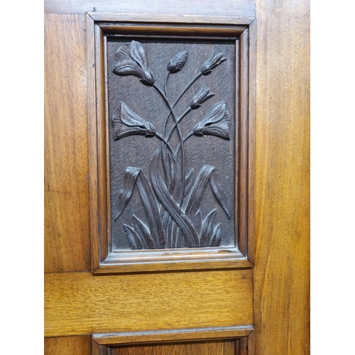 37 - An Edwardian Mirror Door Wardrobe, the moulded cornice above central mirror door, flanked by panelle... 