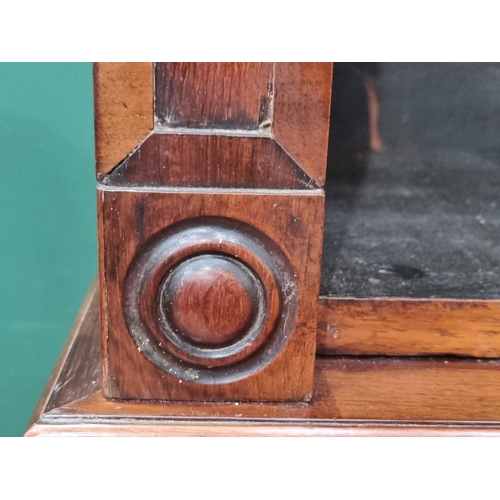 38 - A Victorian rosewood Bookcase the upper section fitted with adjustable shelves above base fitted sin... 