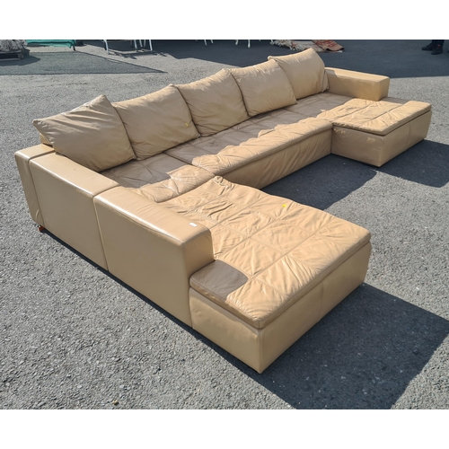 4 - A large 1970's style cream leather L shaped sectional Lounge Suite. (R11).