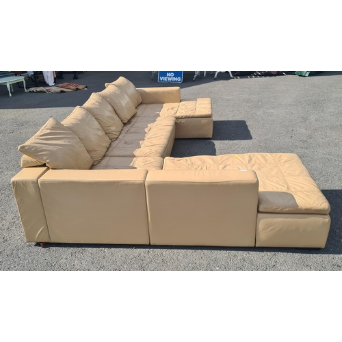 4 - A large 1970's style cream leather L shaped sectional Lounge Suite. (R11).