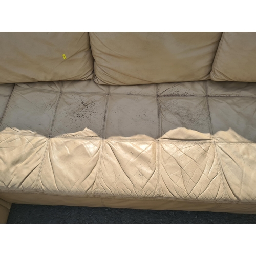 4 - A large 1970's style cream leather L shaped sectional Lounge Suite. (R11).