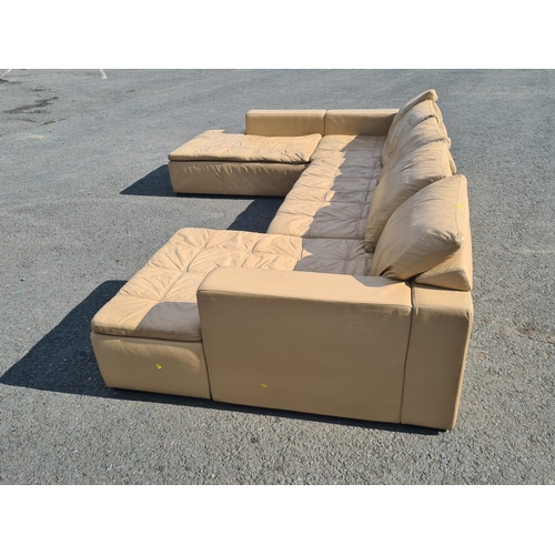 4 - A large 1970's style cream leather L shaped sectional Lounge Suite. (R11).