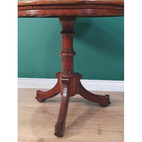 40 - A Victorian oak Pillar Table with circular top having shaped apron on turned supports and tripod bas... 