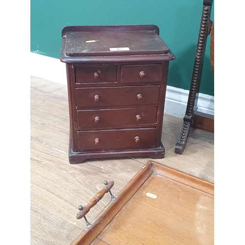 467 - A Victorian stained pine Apprentice Chest of Drawers 12in H x 11in W, an oak two handled Tray, a Dre... 