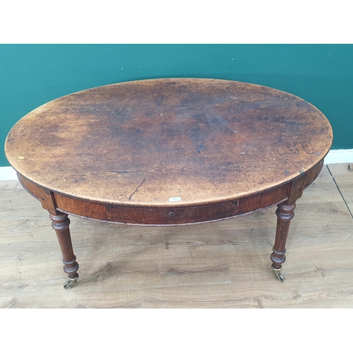 469 - A 19th Century oval Centre Table with pine top on oak turned supports and brass casters 5ft W x 2ft ... 