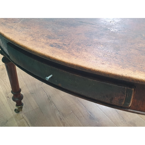 469 - A 19th Century oval Centre Table with pine top on oak turned supports and brass casters 5ft W x 2ft ... 