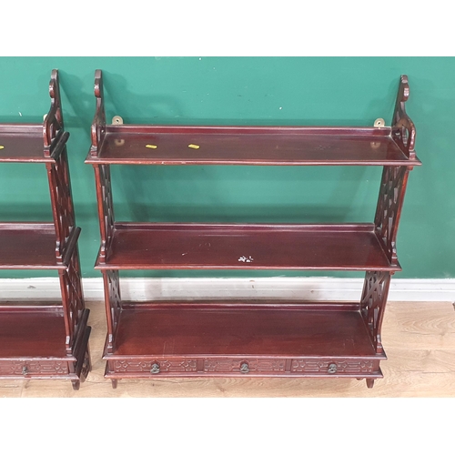 471 - A pair of reproduction mahogany Chippendale style Wall Shelves each fitted three drawers with blind ... 