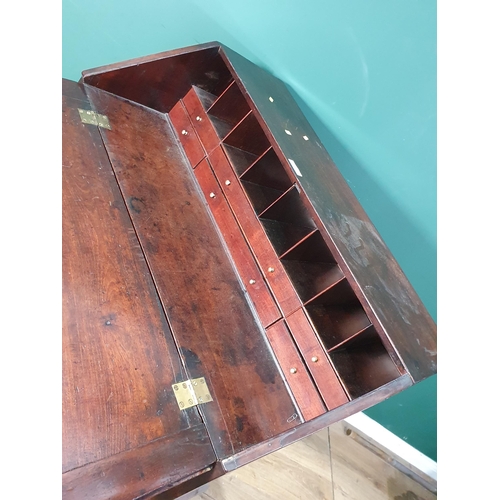 481 - A 19th Century mahogany Bureau with fall front enclosing drawers and pigeon holes raised above above... 