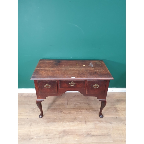 495 - An 18th Century oak Lowboy with moulded top above three drawers raised on cabriole supports 3ft 5in ... 