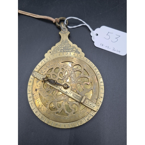 53 - An Islamic/Persian brass Astrolabe with engraved detail and suspension loop (R1)