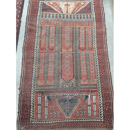 532 - A cream ground woollen Rug with stylised floral design 7ft L x 2ft 9in W and a red ground Prayer Rug... 