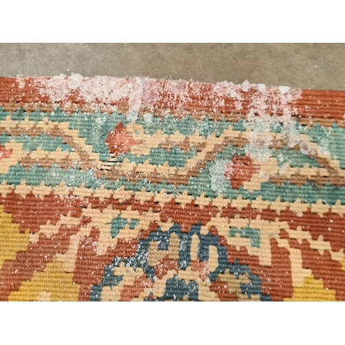 536 - A red ground woolen Rug with pale blue central lozenge with floral design within tramline borders 9f... 