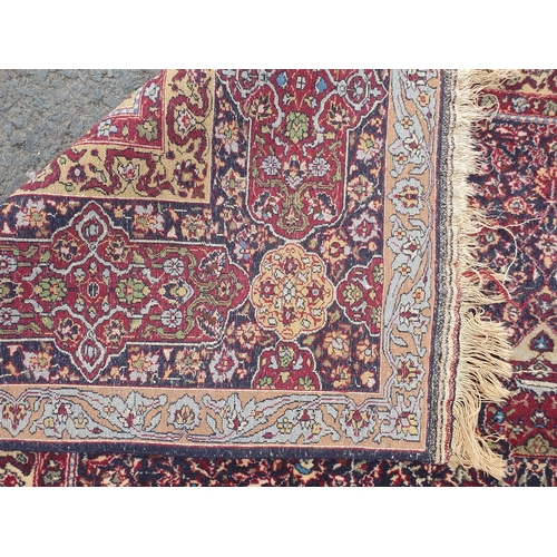 539 - A Persian style Rug with intricate trailing foliate design on purple ground 9ft 2in L x 6ft 2in W (R... 