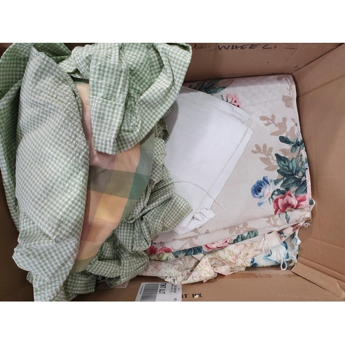 555 - Two Boxes of assorted Textiles including, Cushions, Linen, Curtains, etc. (R6).