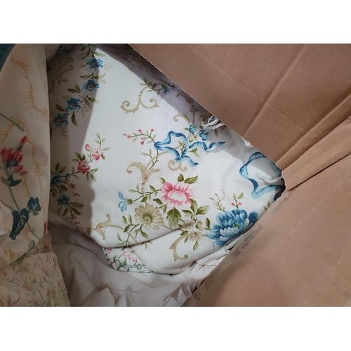 555 - Two Boxes of assorted Textiles including, Cushions, Linen, Curtains, etc. (R6).