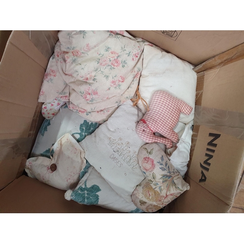 555 - Two Boxes of assorted Textiles including, Cushions, Linen, Curtains, etc. (R6).