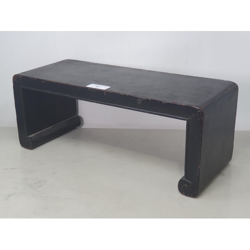 57 - A Chinese black lacquered Stand with shaped supports, 18 x 7in (R3)