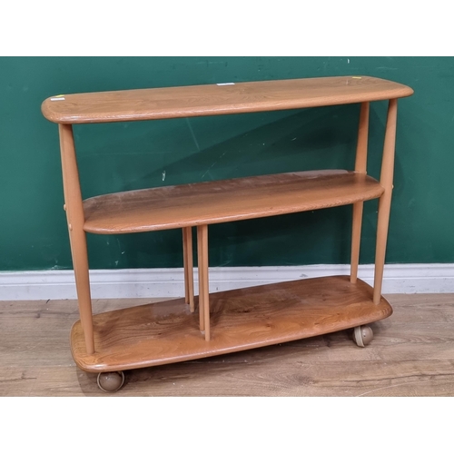 6 - An Ercol blonde elm three tier small Giraffe on casters  3ft  W x 2ft 4in H (R2)