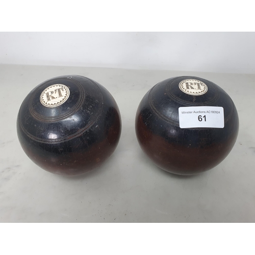 61 - A pair of lignum vitae Bowling Woods inset initials R.T, No 1 & 2, stamped Thomas Taylor, Glasgow (R... 