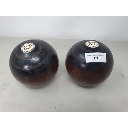 61 - A pair of lignum vitae Bowling Woods inset initials R.T, No 1 & 2, stamped Thomas Taylor, Glasgow (R... 