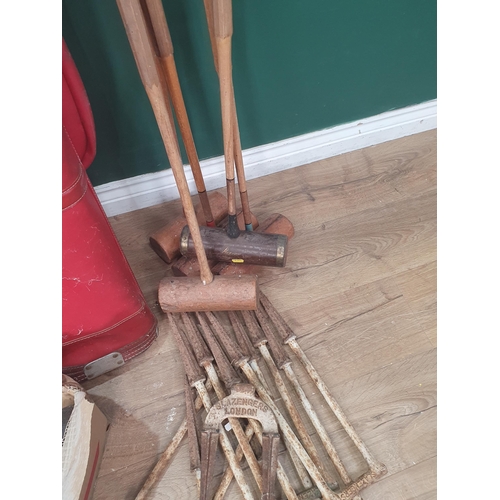 616 - A bag of Dunlop and other Golf Clubs and five Croquet Mallets, Slazenger Hoops and various Balls (R7... 