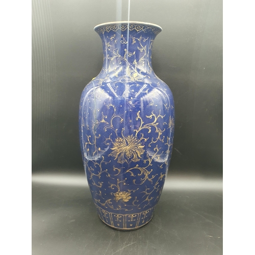 75 - A large Chinese baluster Vase with gilt floral decoration on a blue ground, 19in, old paper labels u... 