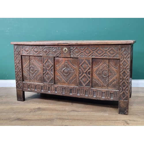 8 - A 17th Century joined oak Coffer with sunken four panel lid above lozenge carved three panel front 3... 