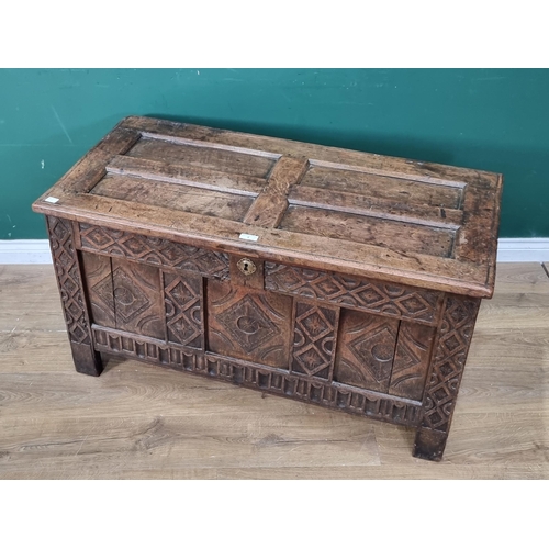 8 - A 17th Century joined oak Coffer with sunken four panel lid above lozenge carved three panel front 3... 